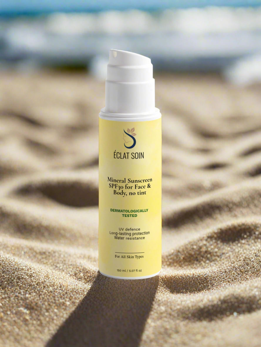 Eclat Soin Mineral SPF30 Sunscreen SPF30 without tint for face and body in a sandy background
